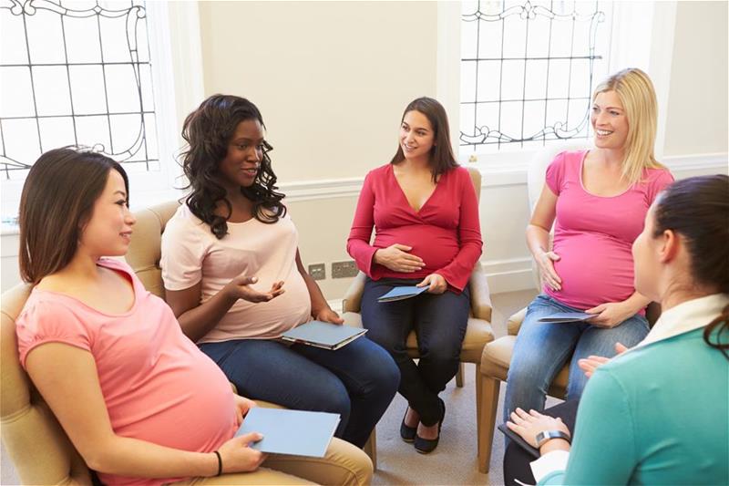 A group of pregnant women conversing