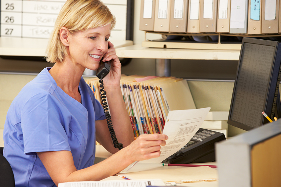 A health care professional talking on the phone