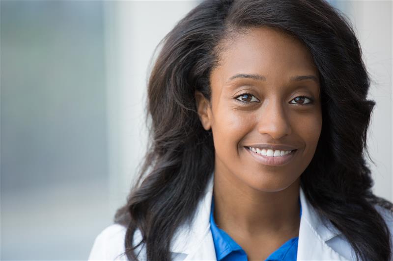 A female health care professional smiling