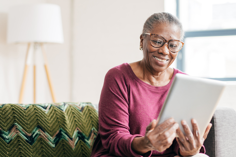 A woman looking at her tablet