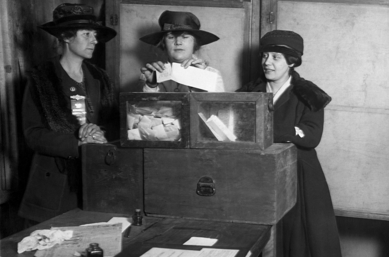 A group of women who fought for their voting rights casting their ballots