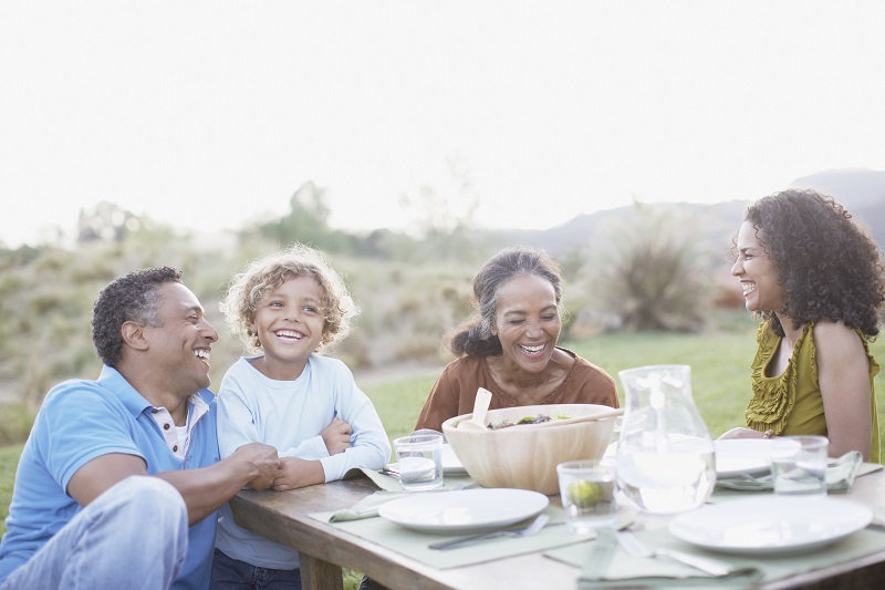 A Multi-generational family enjoying an outdoor picnic