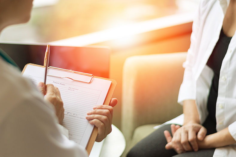 A doctor and patient discussing care