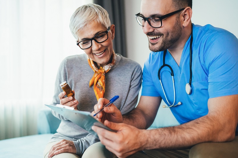 A senior woman consulting with her doctor about a medication