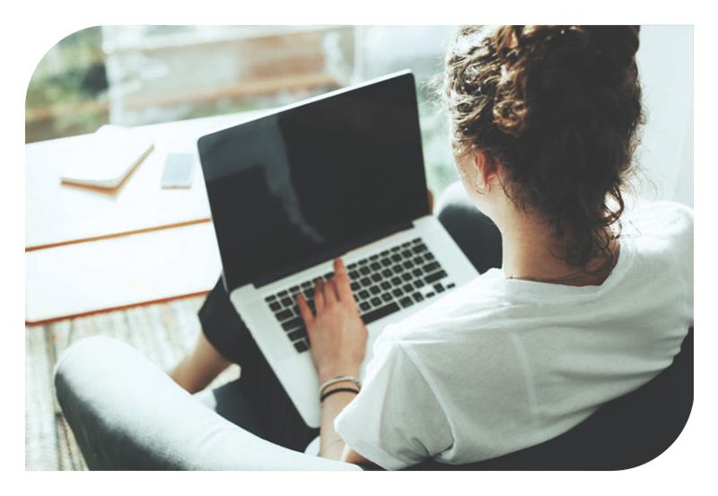 A woman working on a laptop