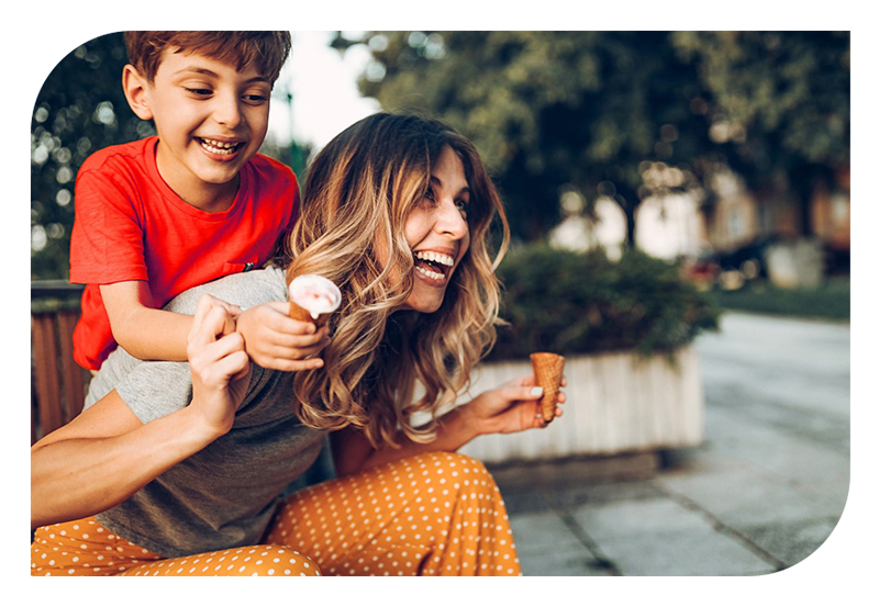 A mom and son enjoying ice cream cones