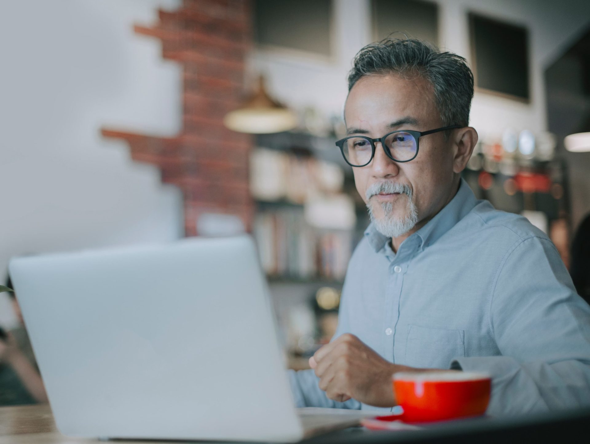 A man on his laptop at home