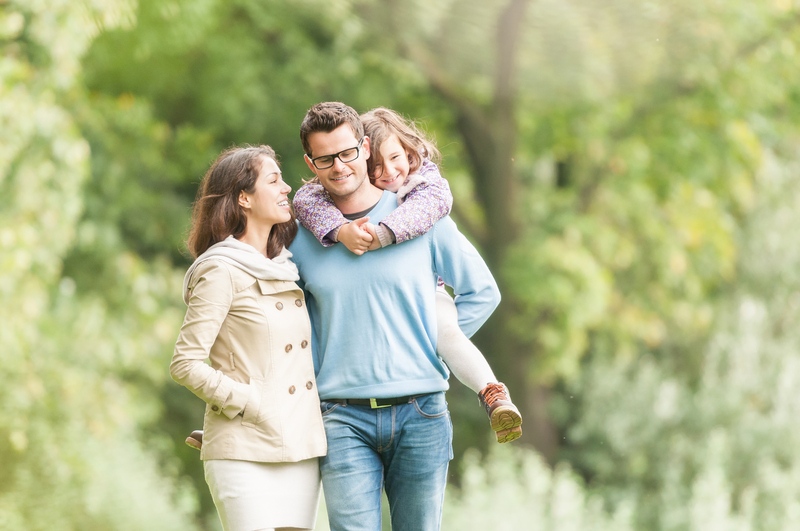 A family of three enjoying the outdoors