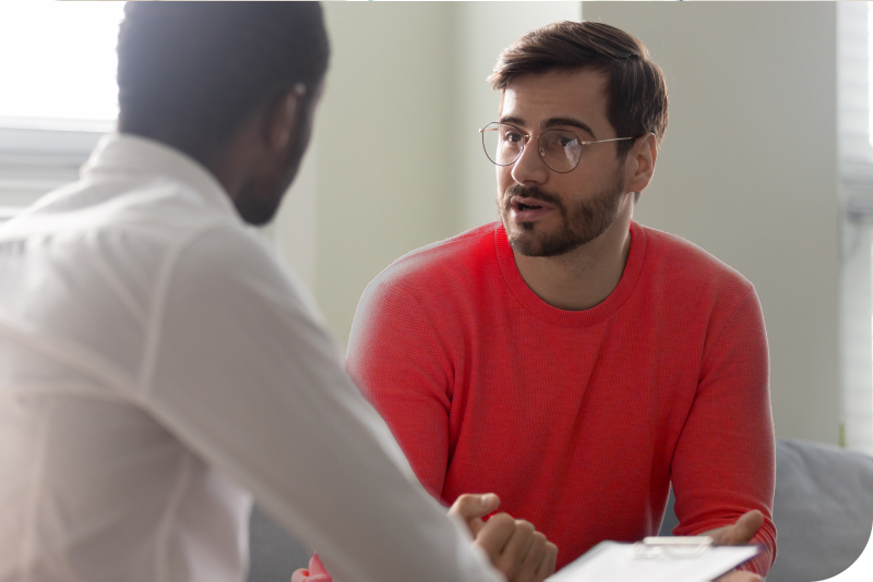 A man conversing with a professional