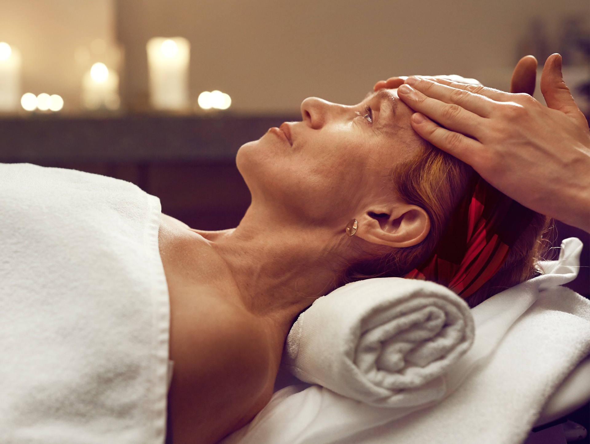 A woman receiving a facial at a spa